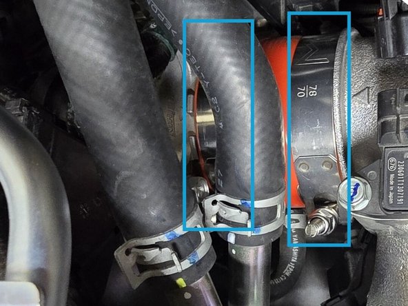 While holding the cold pipe out of the way, push the silicone over the throttle body until flush with the stopper on the throttle body