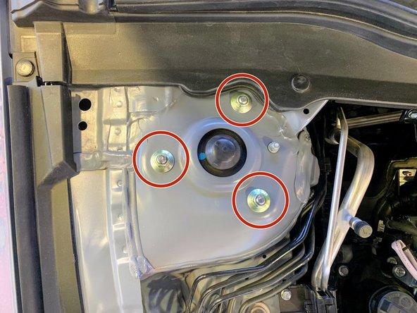 If you have an aftermarket suspension that could move when undone, be sure to note where it is located prior to the removal of the hardware. Failure to do so could change the alignment of your vehicle when reinstalling the strut hardware