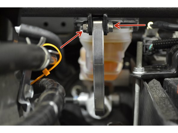 With the brake brace foot adjusted, tighten the M6 bolts and nuts installed earlier using either two 10mm wrenches or one 10mm wrench and a 10mm socket with a ratchet, tighten until snug (24-48 in-lbs)