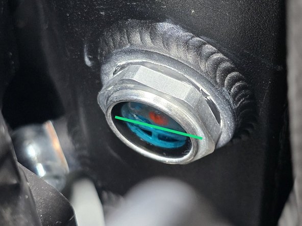 Add new coolant to the reservoir to the bottom to middle of the sight glass. If you are reusing your old coolant then proceed to the next step