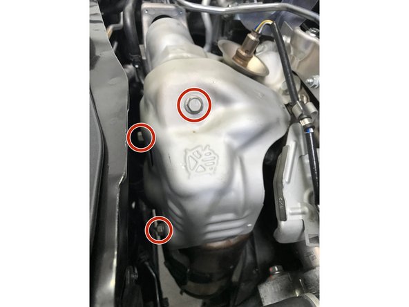 Use a 12mm wrench to install the three (3) 10mm bolts and heat shield.  Torque to 15-19 ft-lbs