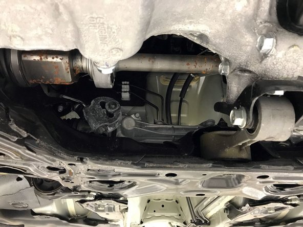 Remove the OE front-pipe from the vehicle through the access point directly under the engine