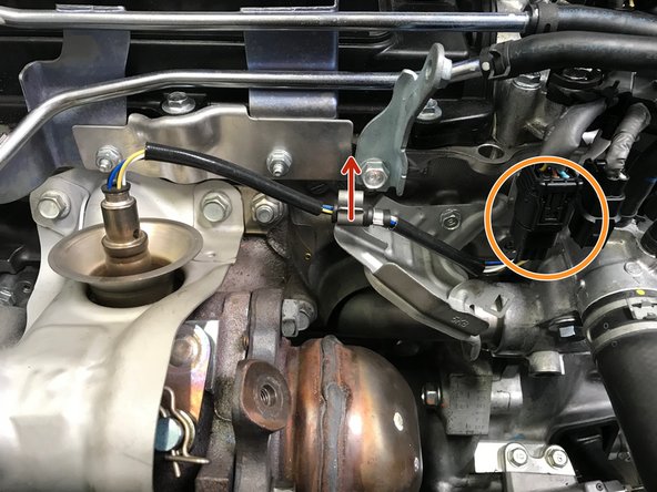 Pull the wire out of the bracket as shown with the red arrow