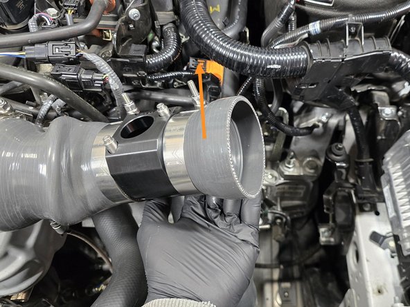 Using your hand lift the silicone stack up as shown to create space for the airbox