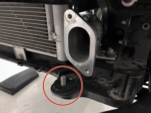 Start by locating the two supplied M10x1.5x30mm bolts. Have these nearby when lifting the intercooler into the vehicle