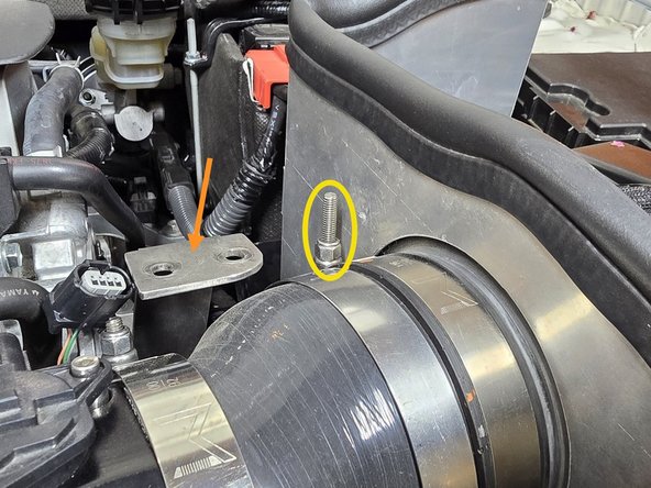 Push the filter bracket off to the side for easy access to the clamps