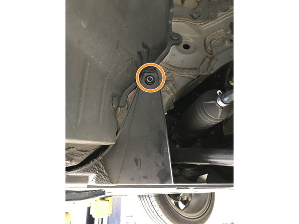 Use large flat head screw driver to remove push-clips on each side of undertray