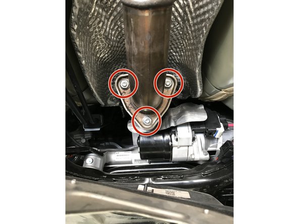 Locate the connection between the front-pipe and down stream exhaust