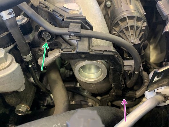 There are 2 bolts holding this bracket. The lower one is well hidden (purple arrow)