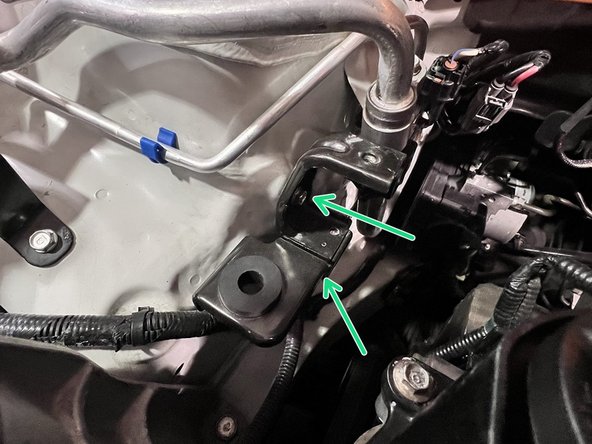 Use a 3/8&quot; ratchet and 10mm socket to remove (2) 10mm bolts securing the lower chassis tank bracket