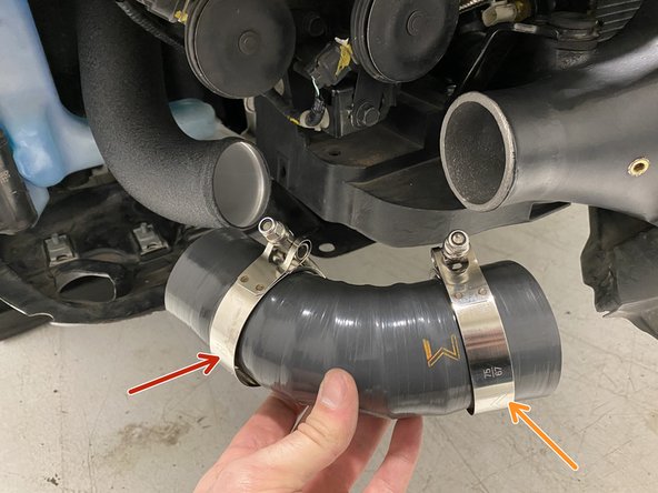 Place a provided 63-71mm T-Bolt clamp onto the hot side IC inlet silicone as shown