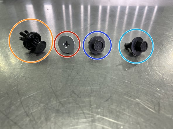 Use a flathead screwdriver or a prying tool to remove the fourteen (14) plastic push-clips circled in orange. Orange arrows identify the eight (8) additional push-clips described in the next step that are removed last