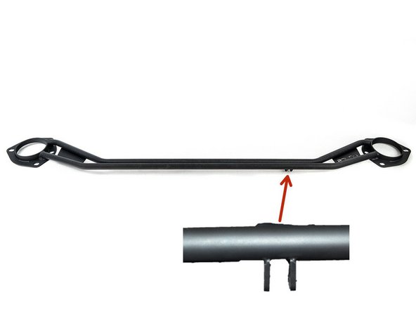 The red arrow shows where the brake brace mounting tabs are located on the front strut tower bar (FSTB)