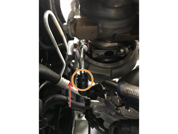 Use pliers to remove the remaining spring clamp on the OE lower rubber coolant hose that is not installed on the engine currently.  Install the spring clamp on the provided rubber coolant hose that is installed on the engine currently