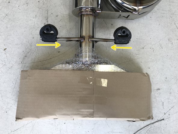 Locate the rearward hanger rod on the 27WON Muffler Section