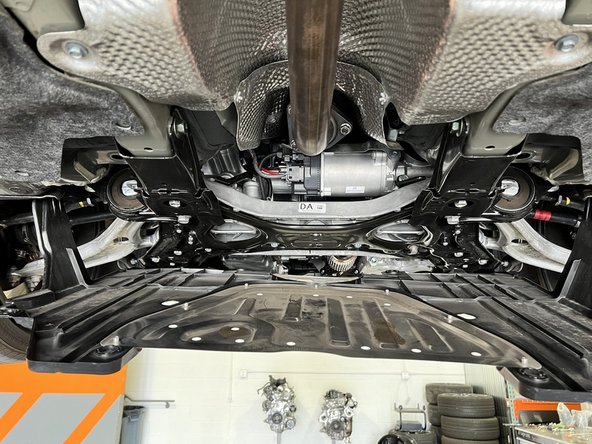 Once all screws and clips are removed your skid plate will hang as shown. It is not required to remove the entire skid plate