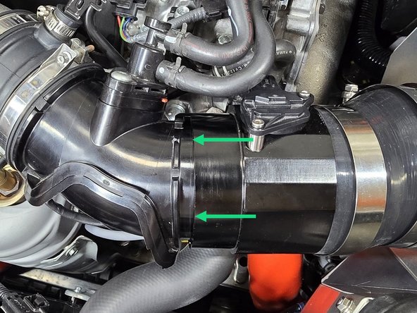 Ensure the small rubber tab aligns with the cut out on the EVAP elbow