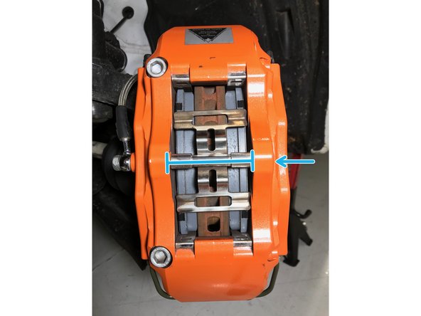 Verify the brake pad material surface is towards the rotor face and the backer plate is towards the pistons