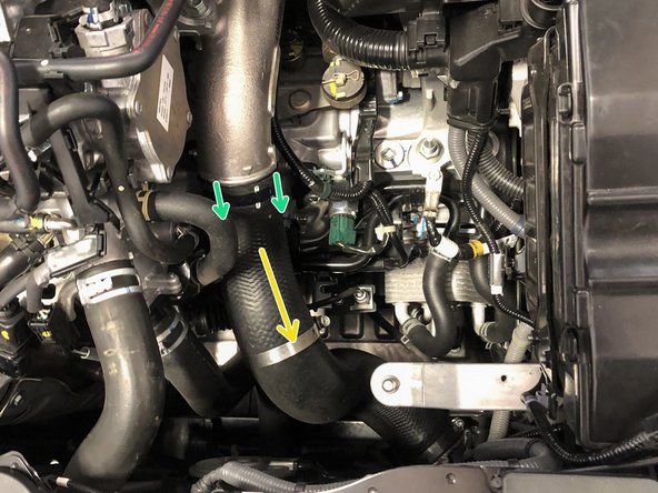 Using a 10mm socket and ratchet, loosen the clamp where the OEM boost tube connects to the OEM cold pipe