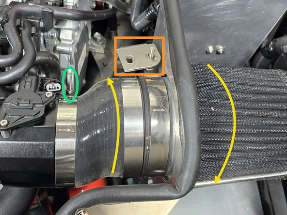 Lift the filter bracket up over the clamp as shown to verify your clamp position