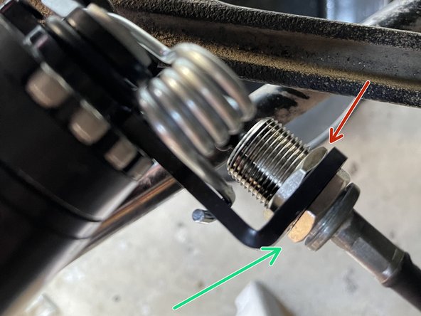 Using the crescent wrench, unthread the adjustment screw to apply mild tension to the cable