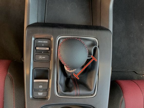 Place provided stainless steel washer on top of OEM locking nut. In this way it will sit in between the shift knob and the locking nut