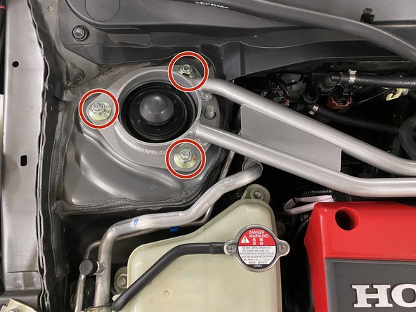 Install the three (3) OEM flange nuts