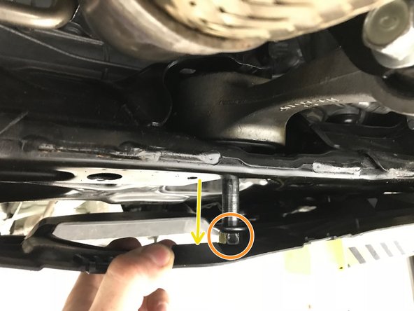 Unthread and remove the 17mm chassis end RMM bolt