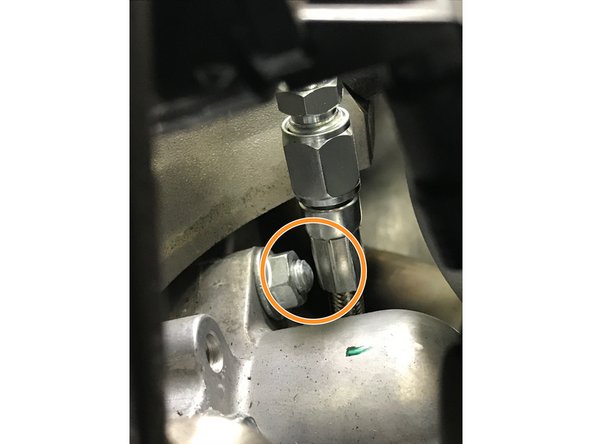 Verify that the oil feed braided hose is not touching or rubbing any components. If touching is occurring loosen the oil feed banjo bolt and adjust the position