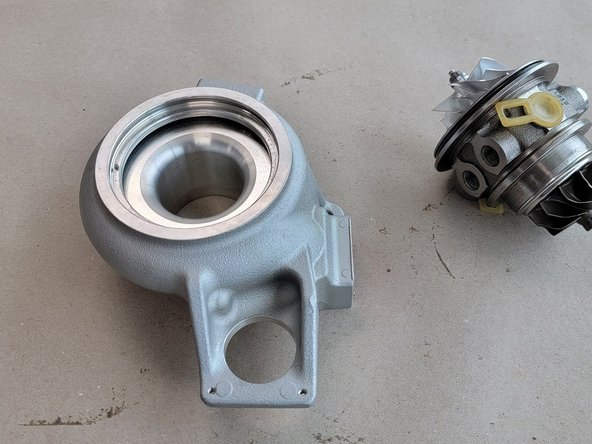 Sometimes the O-ring around the CHRA will stick a little. In this case wiggle the CHRA side to side while holding the compressor cover down being careful to not hit the inside of the cover with the compressor blades