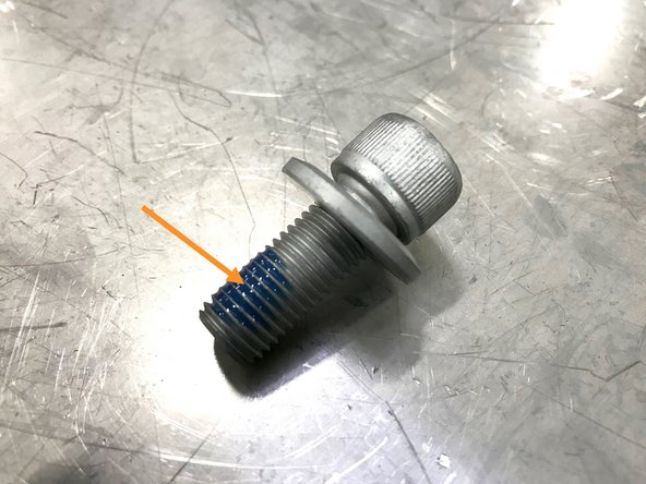 Apply small amount of blue Loc-tite to threads as shown on two of the short socket cap bolts