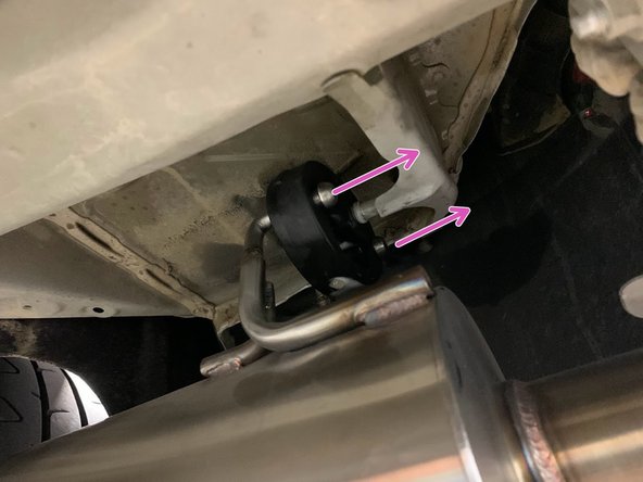 Using a spray cleaner, lubricate the hanger support for the muffler section