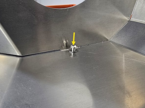 Push the provided M5 socket bolt through the provided washer, and two heat shields as shown