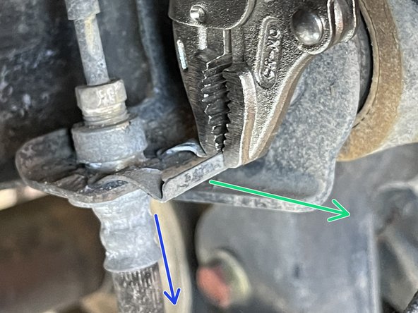 Using a small prybar or vice grips, remove the brake hardline clip