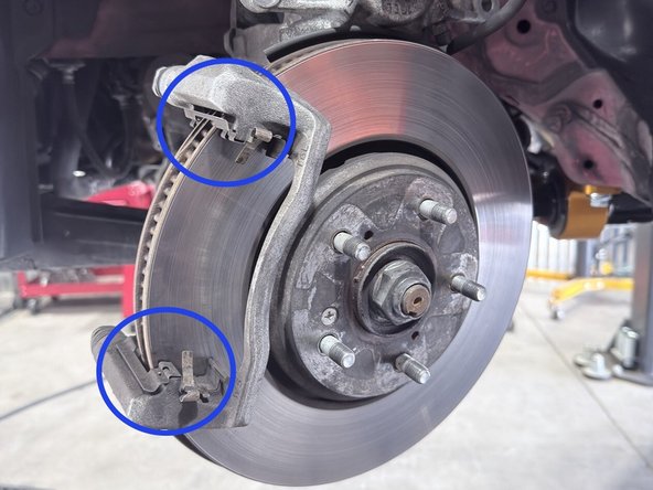 Note the location of the brake pad retaining hardware. This is reused