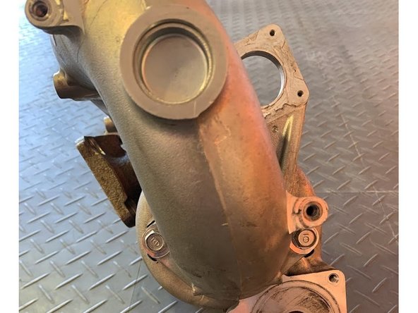 Turbo inlet pipe assembly is shown off the car here because the bolts are hard to see installed on vehicle