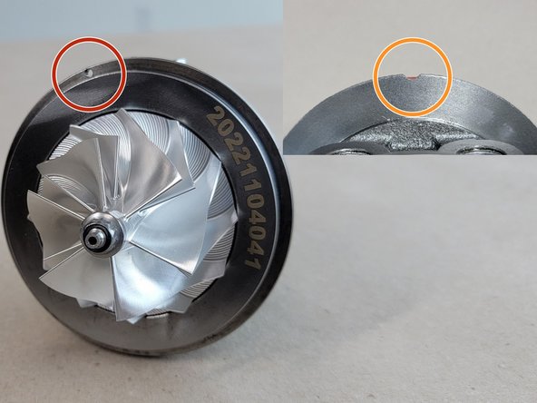 Set the CHRA into the compressor cover ensuring the pin on the cover and the hole on the CHRA align