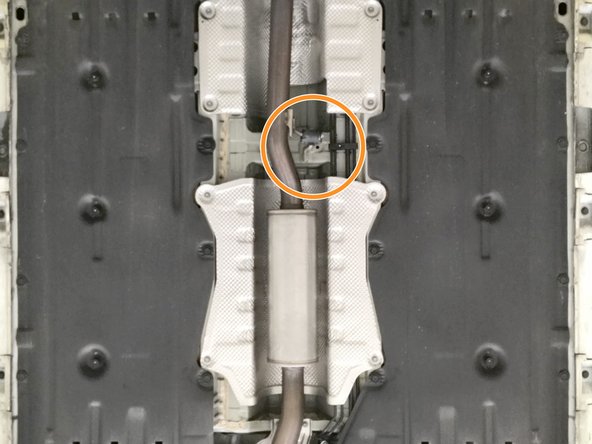 Locate the rubber hanger in the exhaust mid section