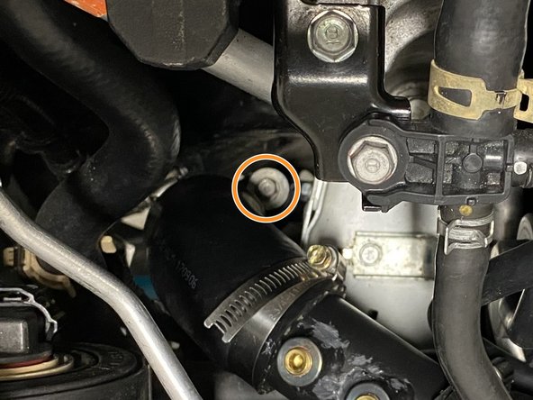 Loosen the band clamp holding the rubber hose to the turbo inlet pipe. Use a 10mm socket, ratchet &amp; extension