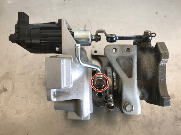 Install the upper coolant pipe on the turbo as shown.  Torque to 21-24 ft-lbs