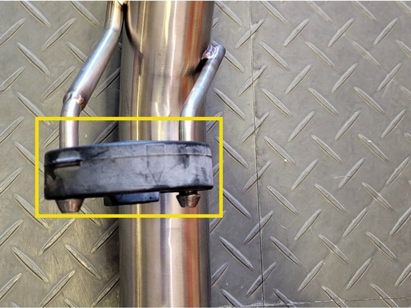 Reinstall the rubber support on the 27WON forward mid-pipe hangers