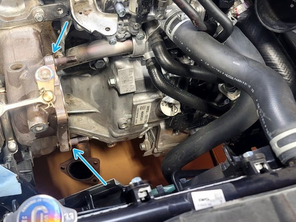 Using the 3/8&quot; drive 14mm socket and ratchet along with the aid of a breaker bar, remove the following from the turbine side of the turbocharger: