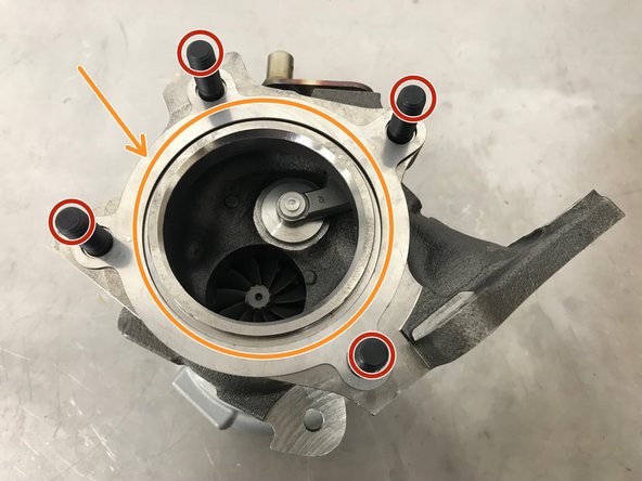 (Shown on bench for Clarity) Install the turbine outlet gasket. There is only way it can be installed