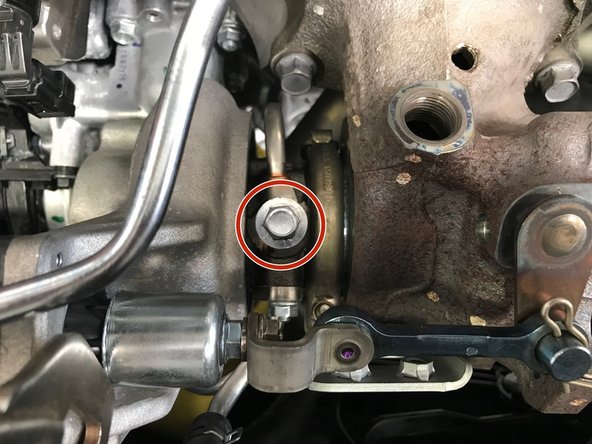 Use a 12mm socket, extension, &amp; ratchet to remove the oil feed banjo bolt