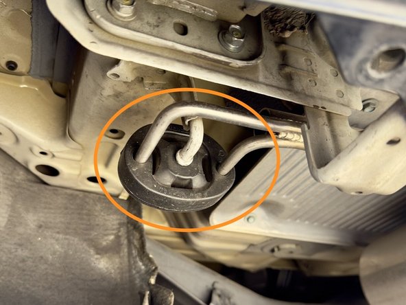 Pull the dual rod rubber hangers off the exhaust hanger rods; the rubber hangers will stay on the vehicle