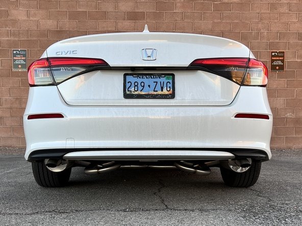 Stand back several feet from the car and inspect the exhaust