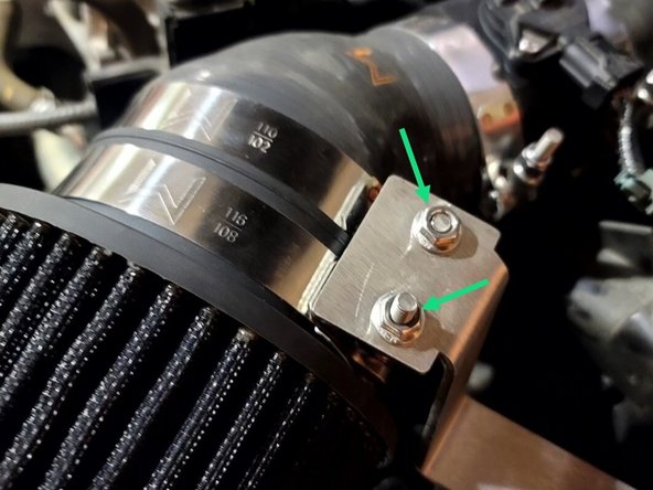 Set bracket over clamp nuts and finger tighten the same two M6 nuts back in place