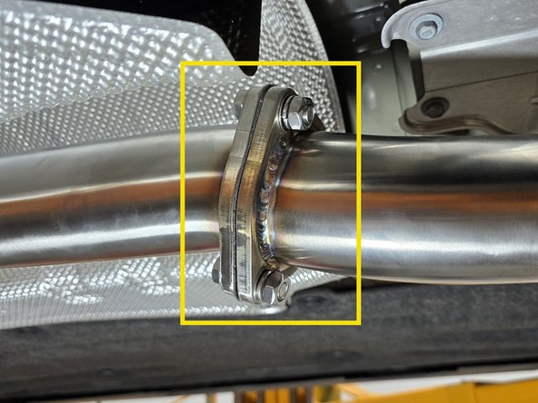 We recommend you have a jack, or a friend support the mid pipe while connecting the flanges