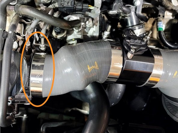 Use a 10mm socket and 3/8&quot; ratchet to loosen the clamp connecting the SRI to the Turbo Inlet Pipe (TIP)