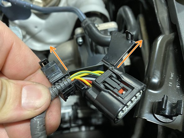 With the tabs slightly pryed out, you can pull the cover flaps up and out as shown